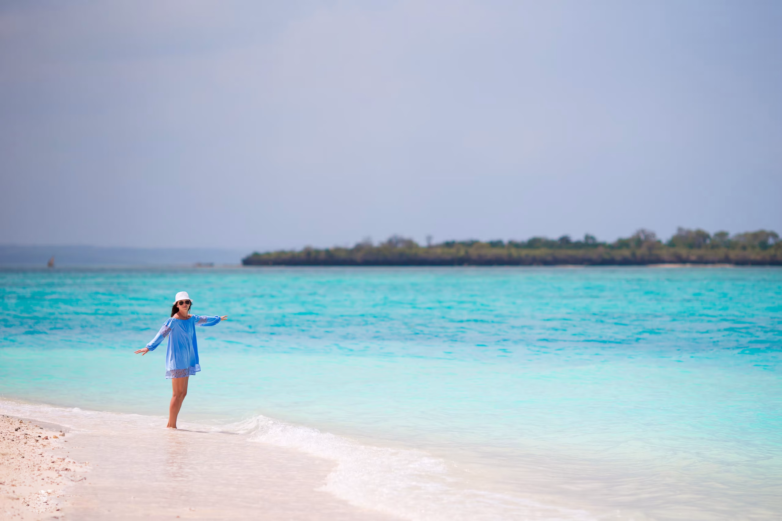 Zanzibar turquoise ocean with dhow sailing